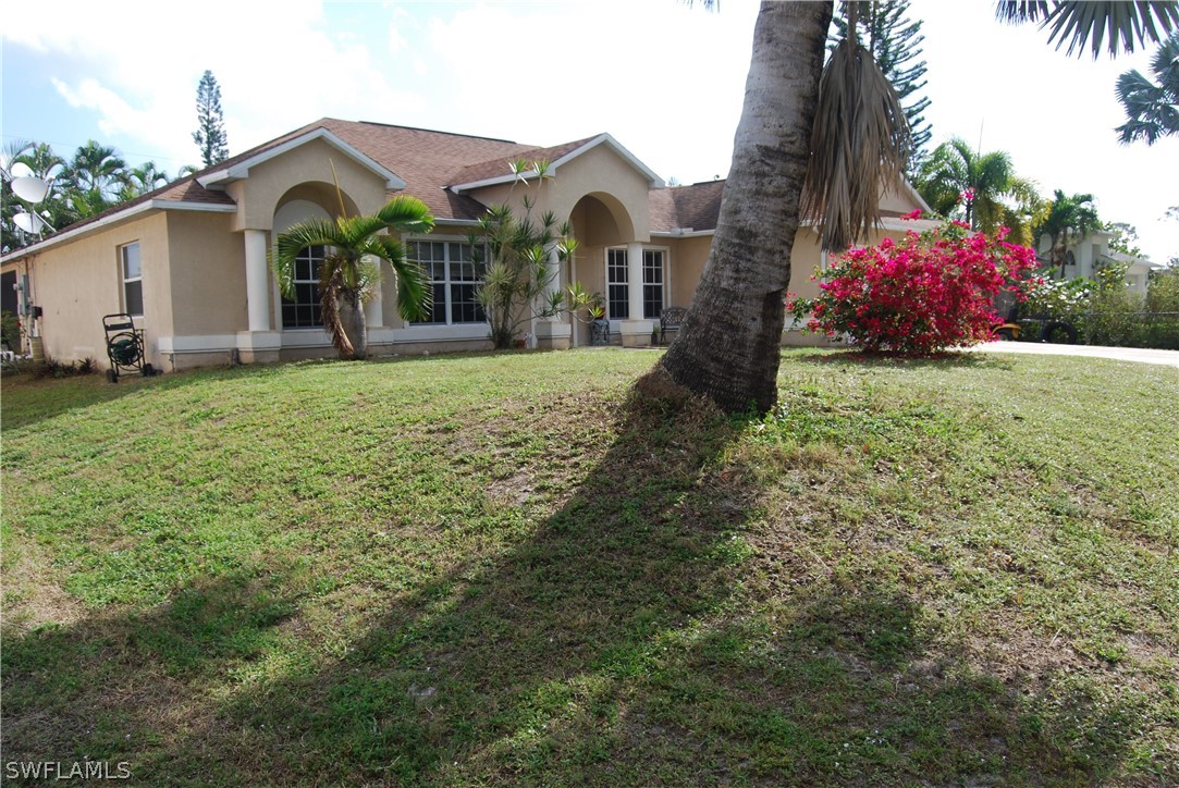 18561 Olive Road Fort Myers, FL 33967 - Photo 34 of 35 a front view of a house with garden