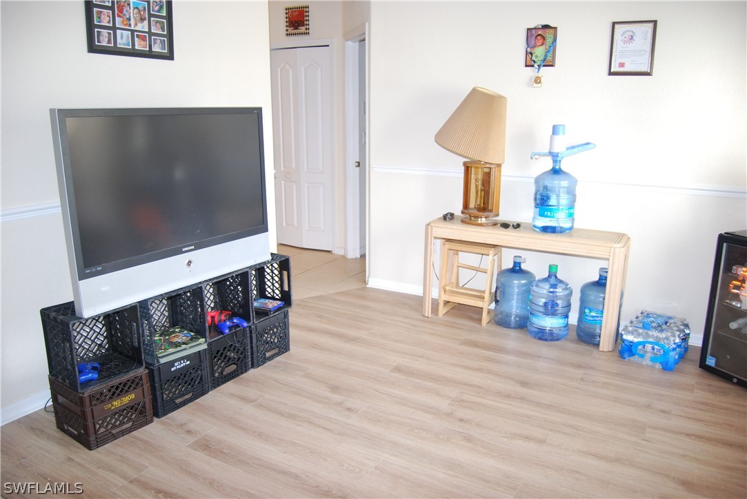 18561 Olive Road Fort Myers, FL 33967 - Photo 6 of 35 a living room with furniture and a flat screen tv
