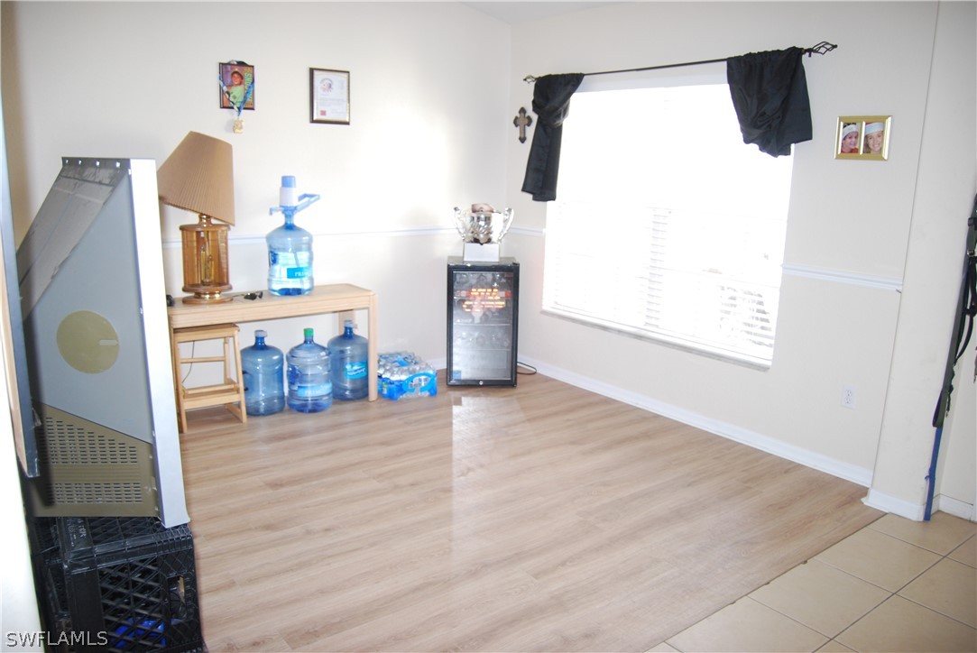 18561 Olive Road Fort Myers, FL 33967 - Photo 7 of 35 a view of kitchen and living room