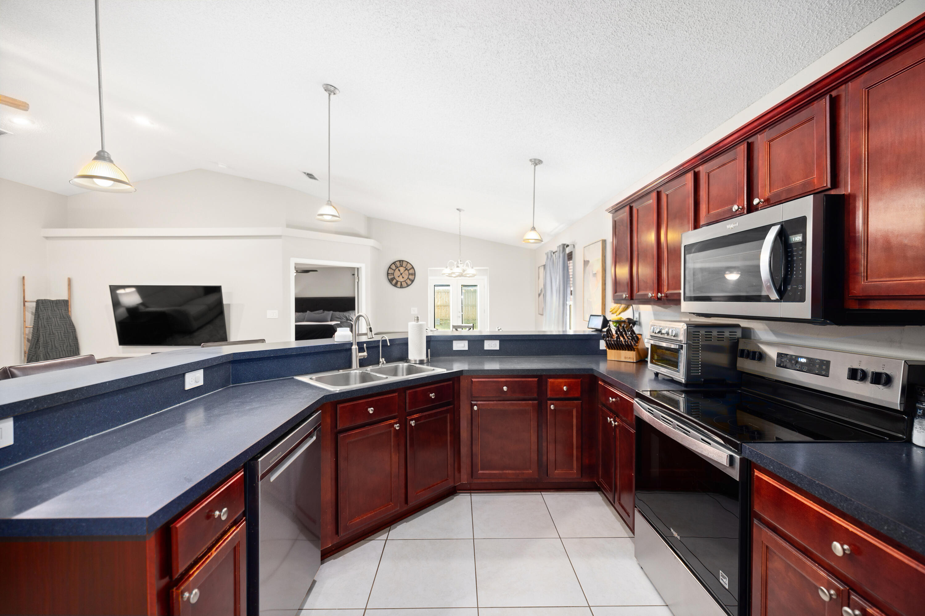 202 Limestone Circle Crestview, FL 32539 - Photo 12 of 49 a kitchen with stainless steel appliances a sink stove and microwave