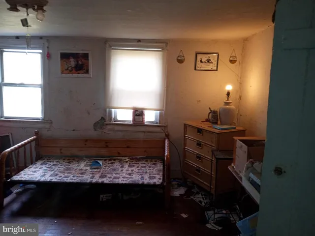 a room with a bed and a window