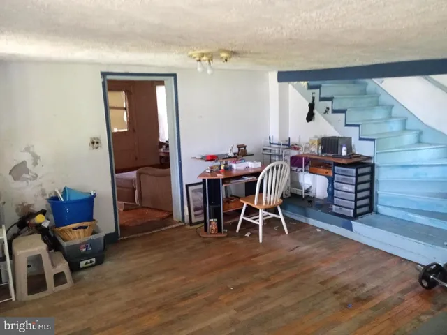 a view of a livingroom with furniture and wooden floor