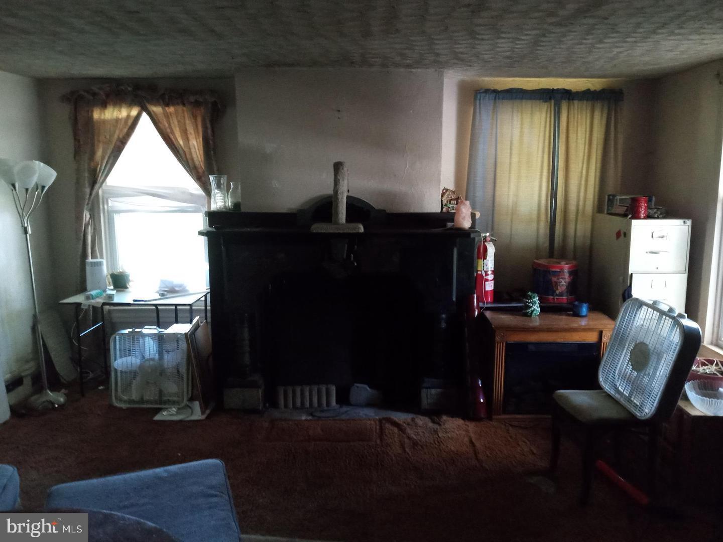 705 Bethel Church Road Middletown, DE 19709 - Photo 7 of 17 a living room with furniture windows and a fireplace