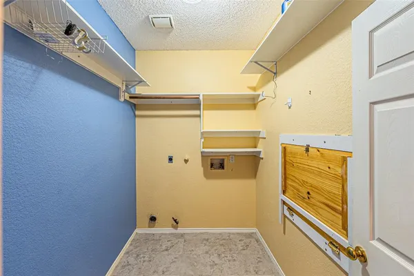 a bathroom with a sink and glass door