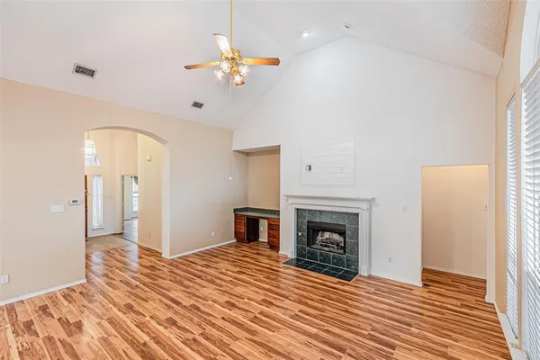 a bedroom with a bed and a fireplace