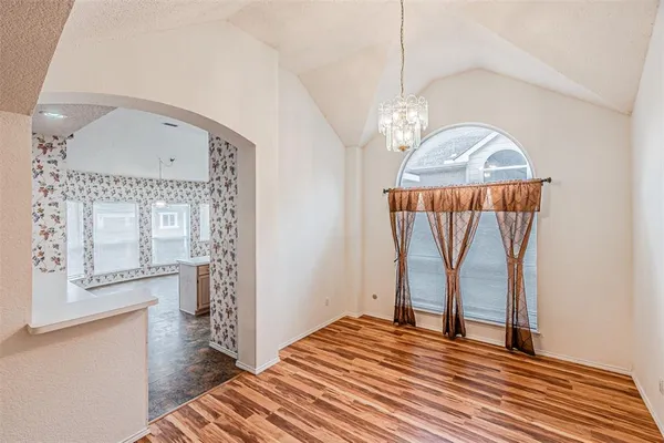 a bedroom with a bed and a mirror