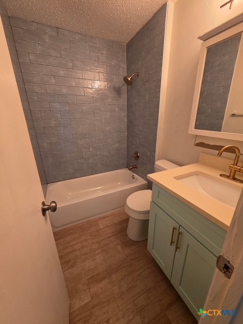 2010 South 15th Street, Unit B Temple, TX 76504 - Photo 9 of 12 a bathroom with a sink a toilet and shower