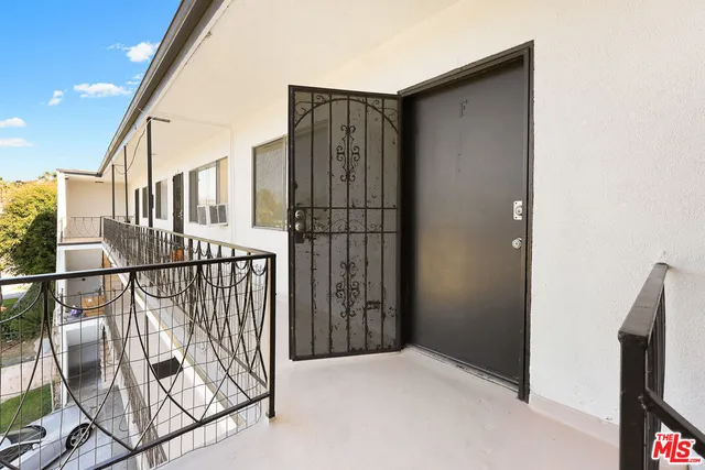 an empty room with wooden floor