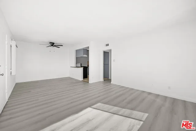 a view of a kitchen with a sink and cabinets