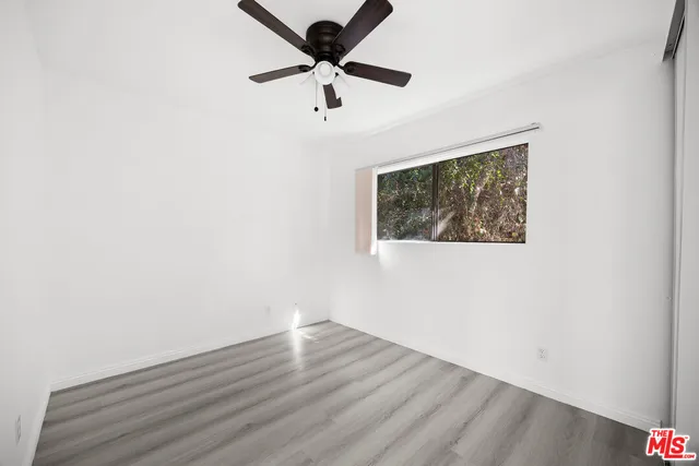 a bathroom with a sink mirror and toilet