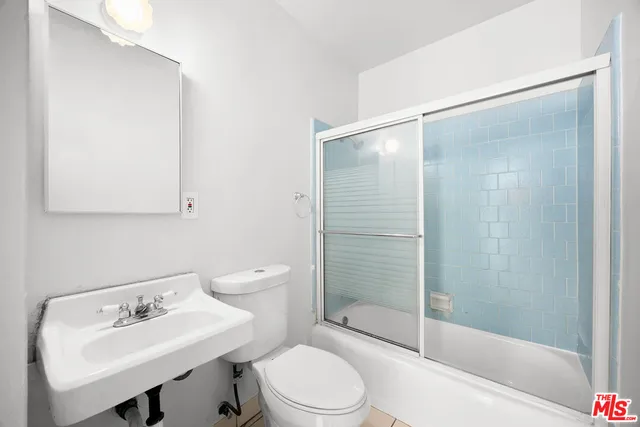 an aerial view of residential building and ocean