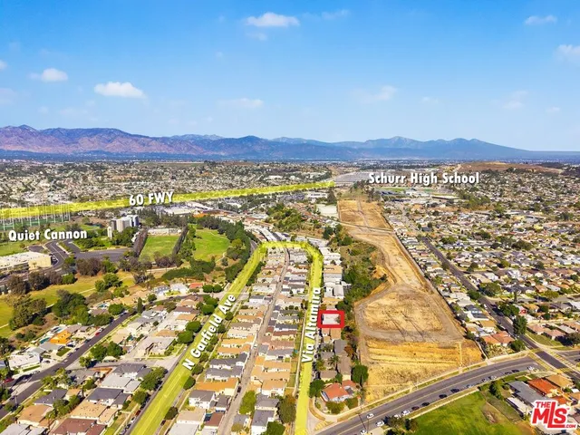 an aerial view of residential building and ocean view
