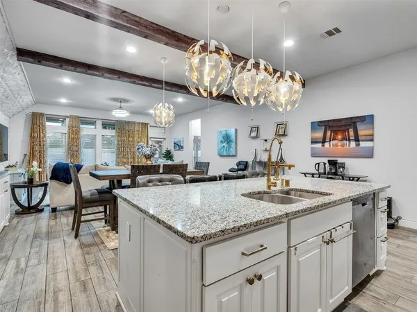 a kitchen with a table and chairs in it