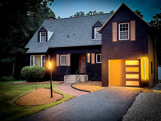 a front view of a house with a yard