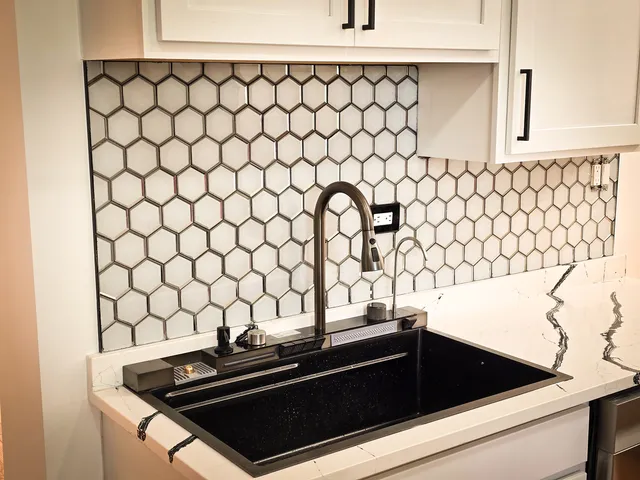 a close view of a sink and a stove