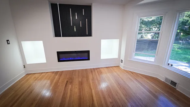 a view of an empty room with a window