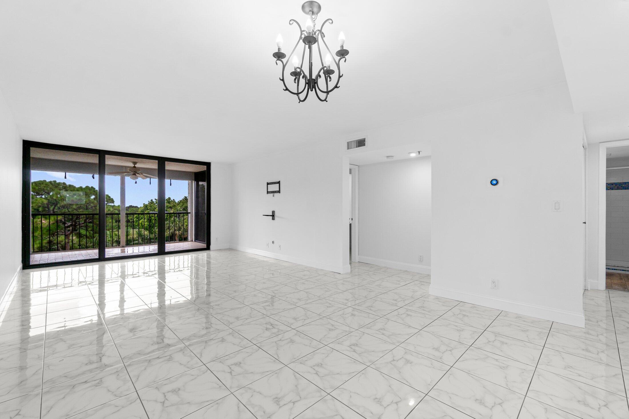 6562 Boca Del Mar Drive, Unit 527 Boca Raton, FL 33433 - Photo 11 of 38 a view of empty room with a large window