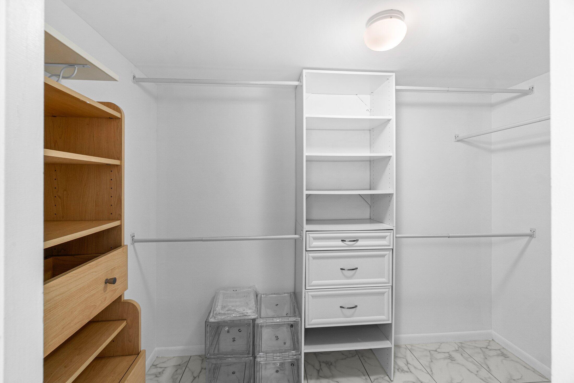 6562 Boca Del Mar Drive, Unit 527 Boca Raton, FL 33433 - Photo 19 of 38 a view of walk in closet with empty racks