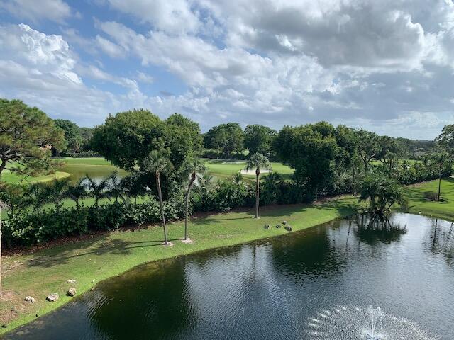 6562 Boca Del Mar Drive, Unit 527 Boca Raton, FL 33433 - Photo 25 of 38 a view of a lake with a yard