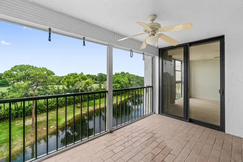 a view of a balcony with a ceiling fan