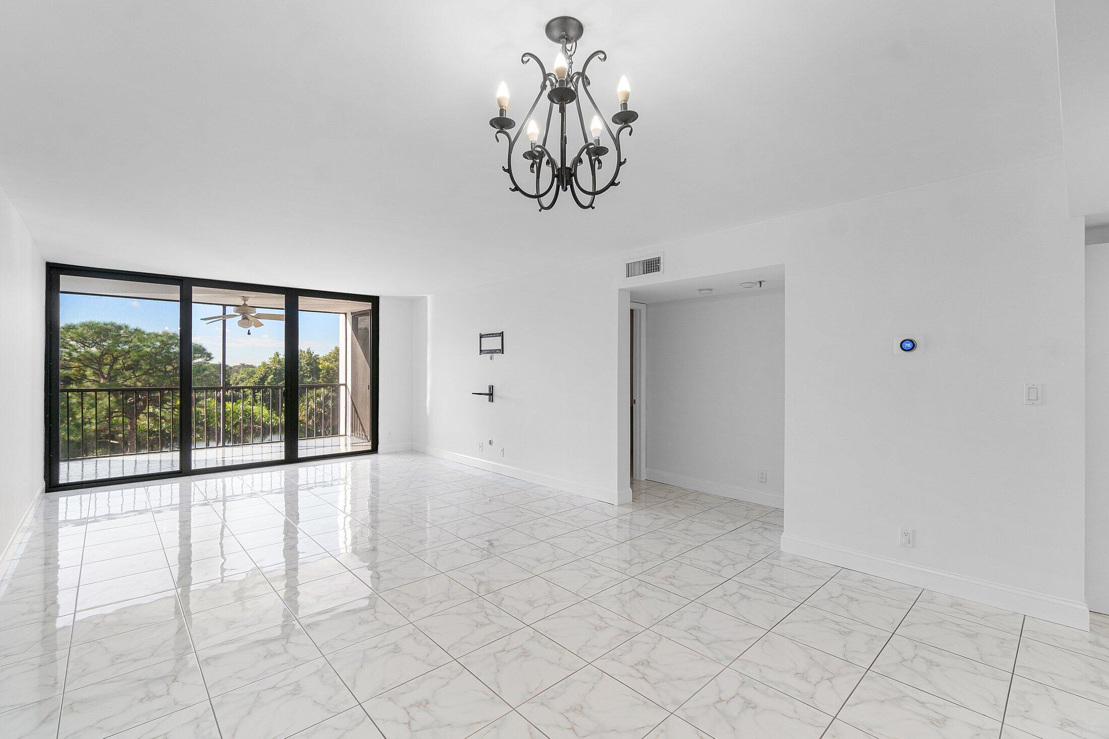 6562 Boca Del Mar Drive, Unit 527 Boca Raton, FL 33433 - Photo 8 of 38 a view of an empty room with a window