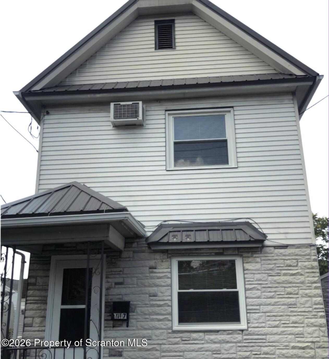 707 Prospect Avenue, Unit REAR Scranton, PA 18505 - Photo 1 of 11 a front view of a house with a door