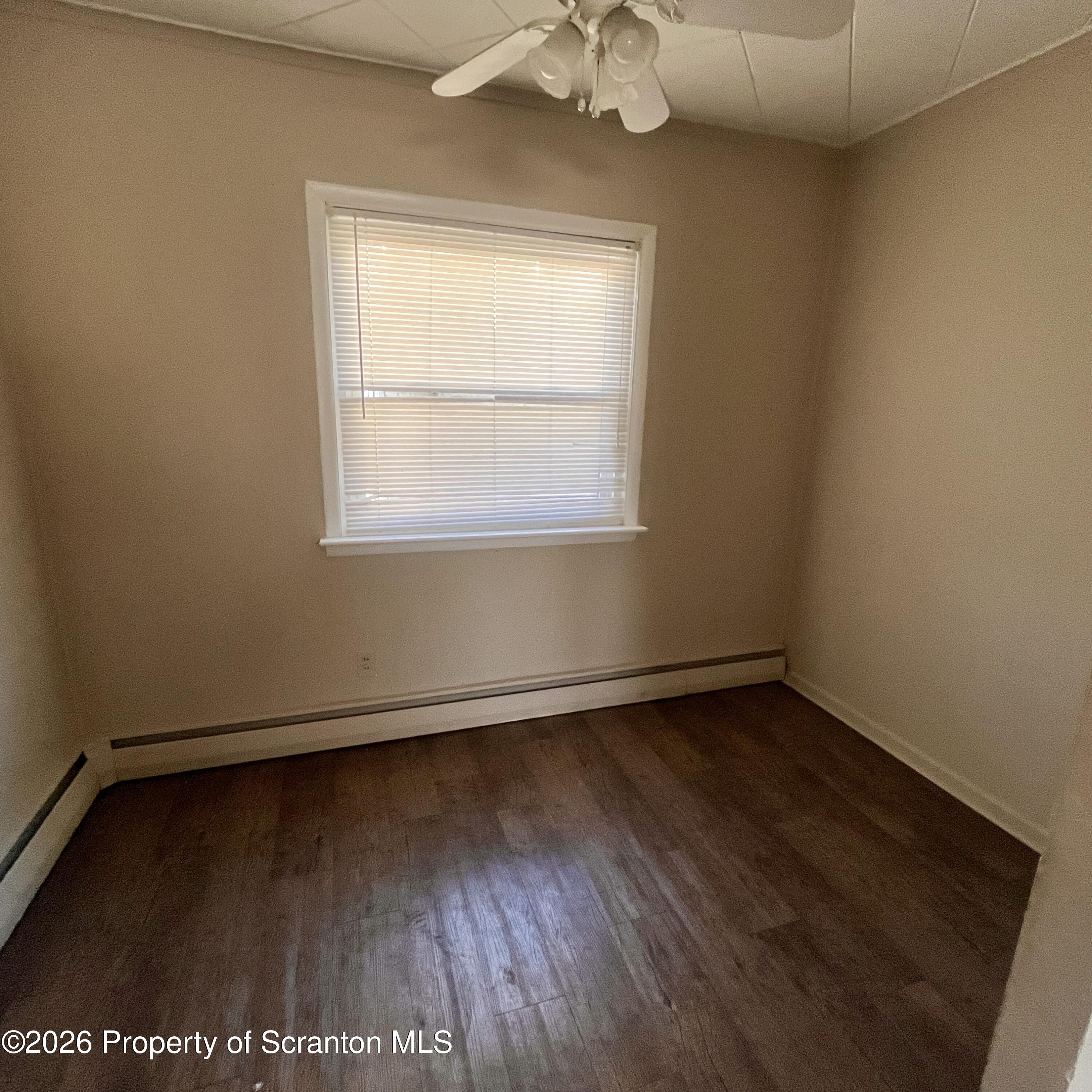 707 Prospect Avenue, Unit REAR Scranton, PA 18505 - Photo 7 of 11 an empty room with a window