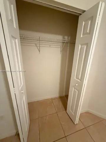 a bathroom with a sink a mirror and a bath tub