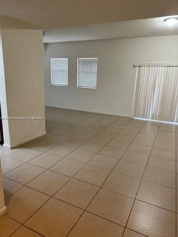 a kitchen with stainless steel appliances a sink a stove a microwave a counter top and cabinets