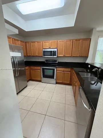 a view of an empty room and a window