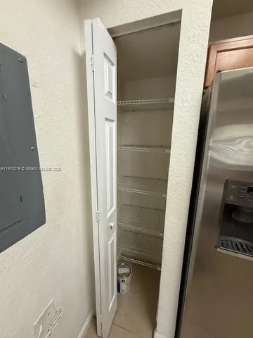 an empty room with a bench