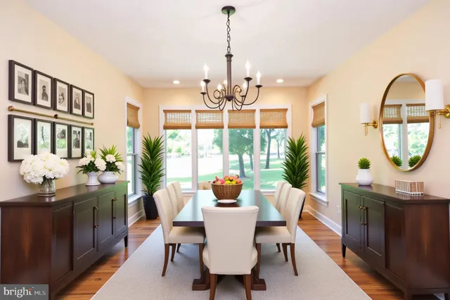 a dining room with furniture window and outside view