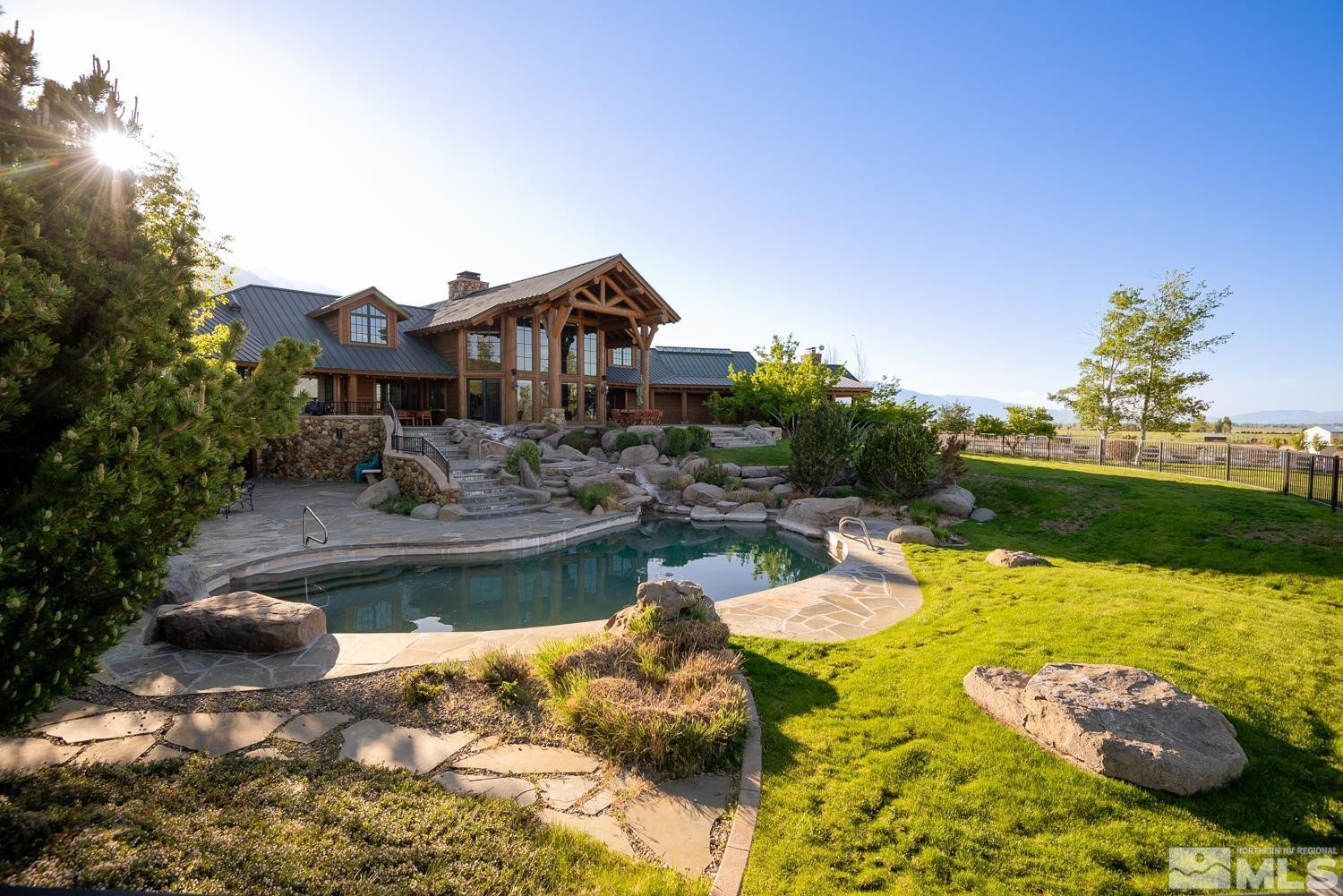 281 Fredricksburg Road Gardnerville, NV 89460 - Photo 2 of 38 a view of a swimming pool with a patio