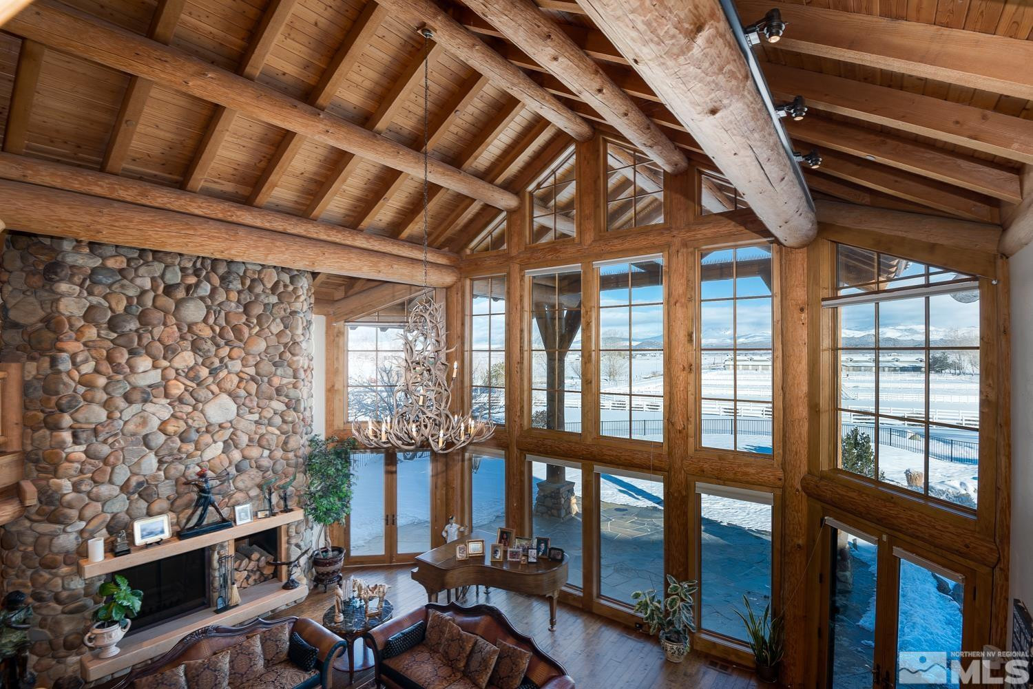 281 Fredricksburg Road Gardnerville, NV 89460 - Photo 21 of 38 a view of a porch with furniture and floor to ceiling window