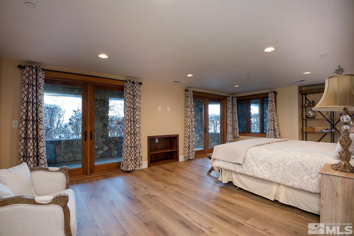 281 Fredricksburg Road Gardnerville, NV 89460 - Photo 25 of 38 a bedroom with a large bed and a large window