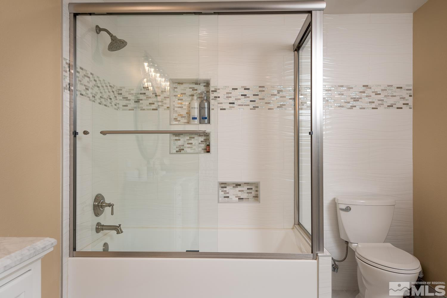 281 Fredricksburg Road Gardnerville, NV 89460 - Photo 26 of 38 a bathroom with a bathtub and a toilet