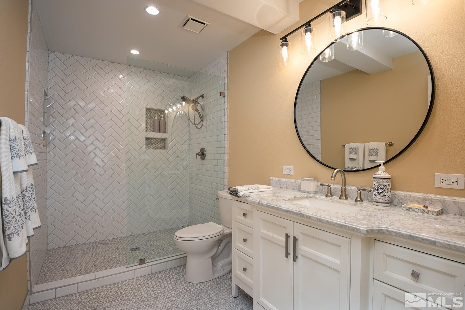 281 Fredricksburg Road Gardnerville, NV 89460 - Photo 34 of 38 a bathroom with a granite countertop sink mirror vanity and toilet