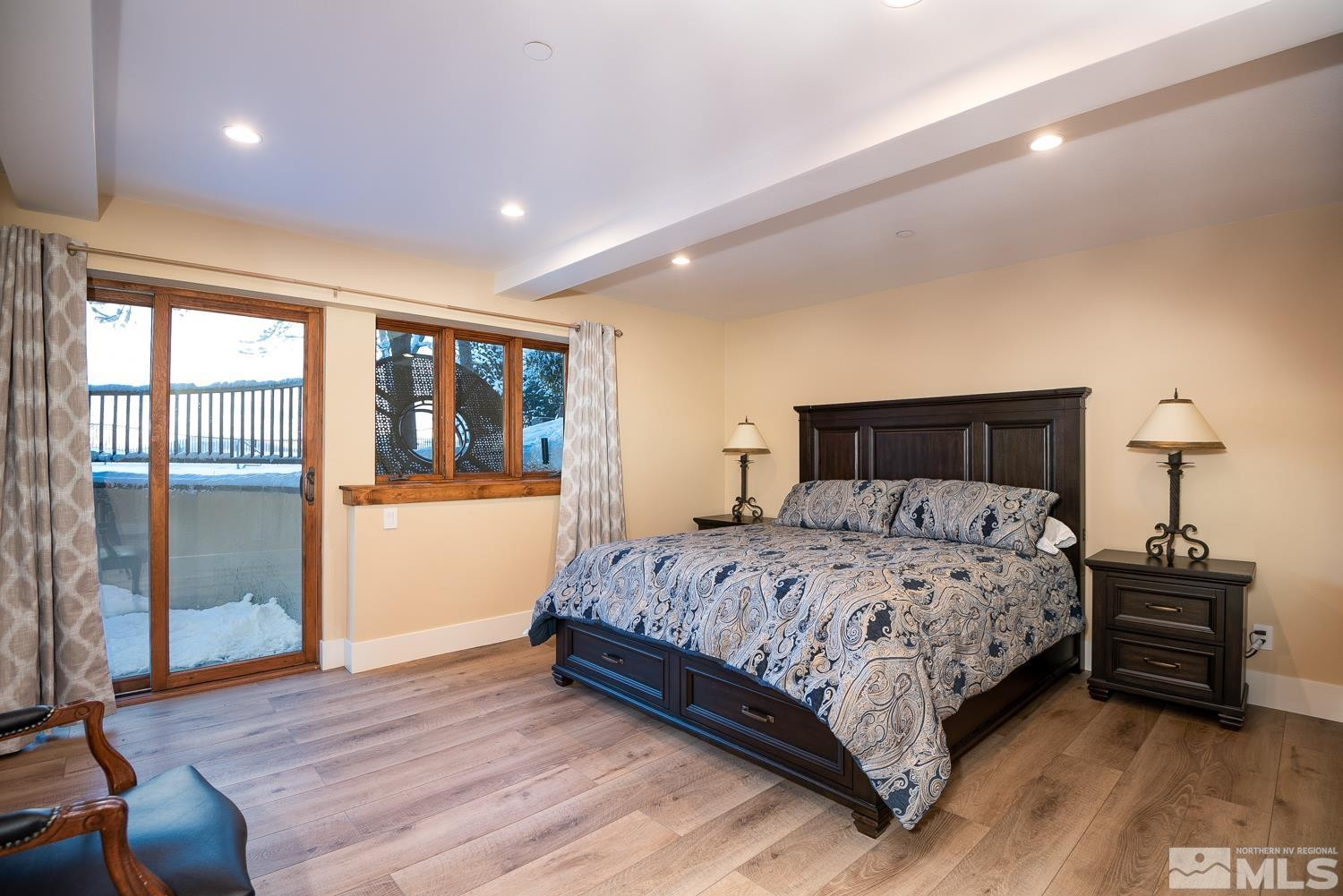 281 Fredricksburg Road Gardnerville, NV 89460 - Photo 35 of 38 a bedroom with a bed and wooden floor