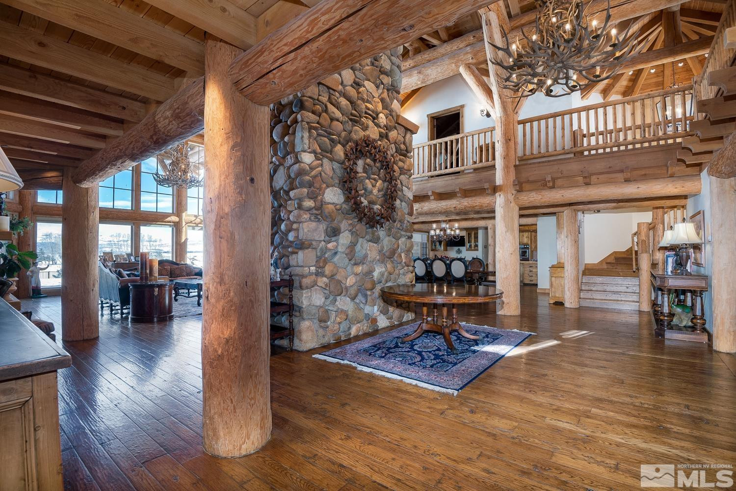 281 Fredricksburg Road Gardnerville, NV 89460 - Photo 6 of 38 a living room with furniture a fireplace and wooden floor