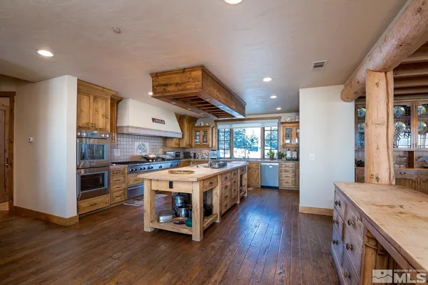 a kitchen with a stove a sink and a refrigerator