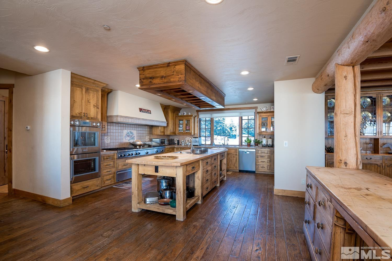 281 Fredricksburg Road Gardnerville, NV 89460 - Photo 7 of 38 a kitchen with a stove a sink and a refrigerator
