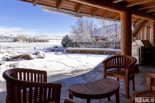 a view of balcony with wooden floor and outdoor seating