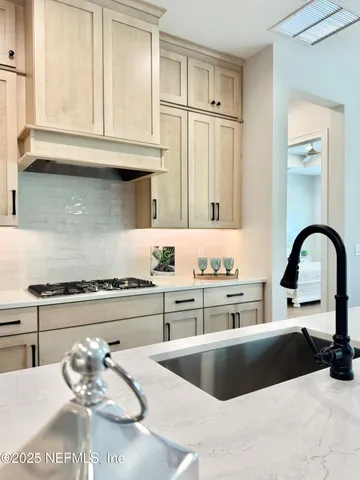 a kitchen with stainless steel appliances granite countertop a sink and cabinets