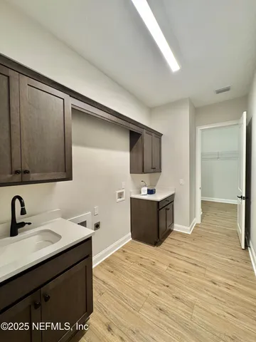 a kitchen with a sink and cabinets
