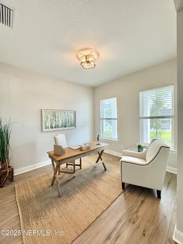 a living room with furniture and a window