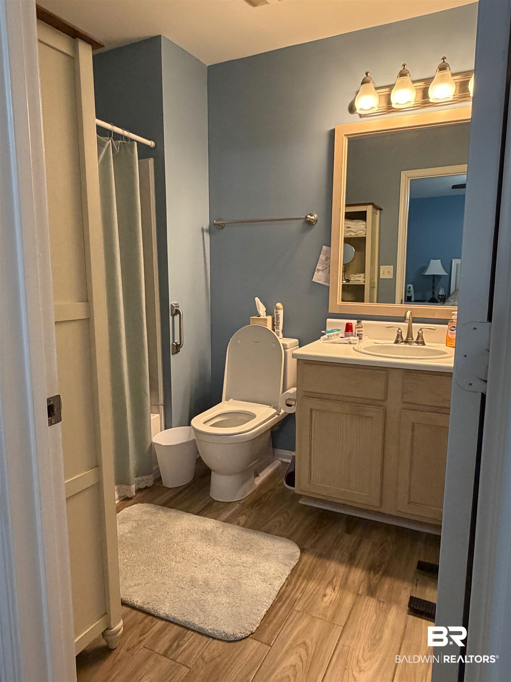 1517 Regency Road, Unit 71 Gulf Shores, AL 36542 - Photo 3 of 26 Full bath featuring shower / bath combo, vanity, and light wood-type flooring
