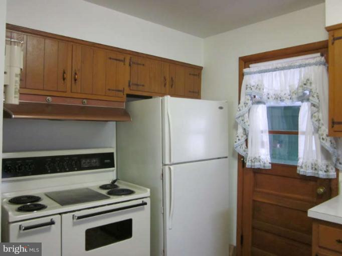 419 Reckord Road Fallston, MD 21047 - Photo 27 of 28 a kitchen with refrigerator and cabinets