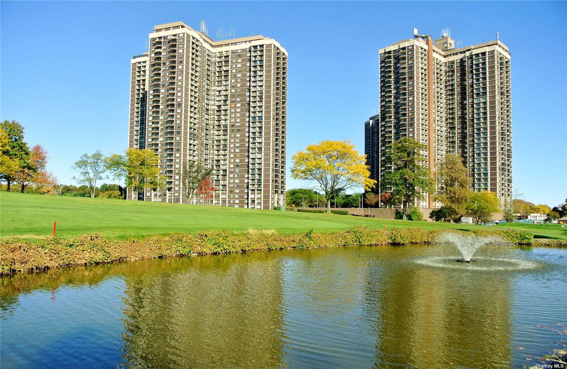 a view of lake with tall building