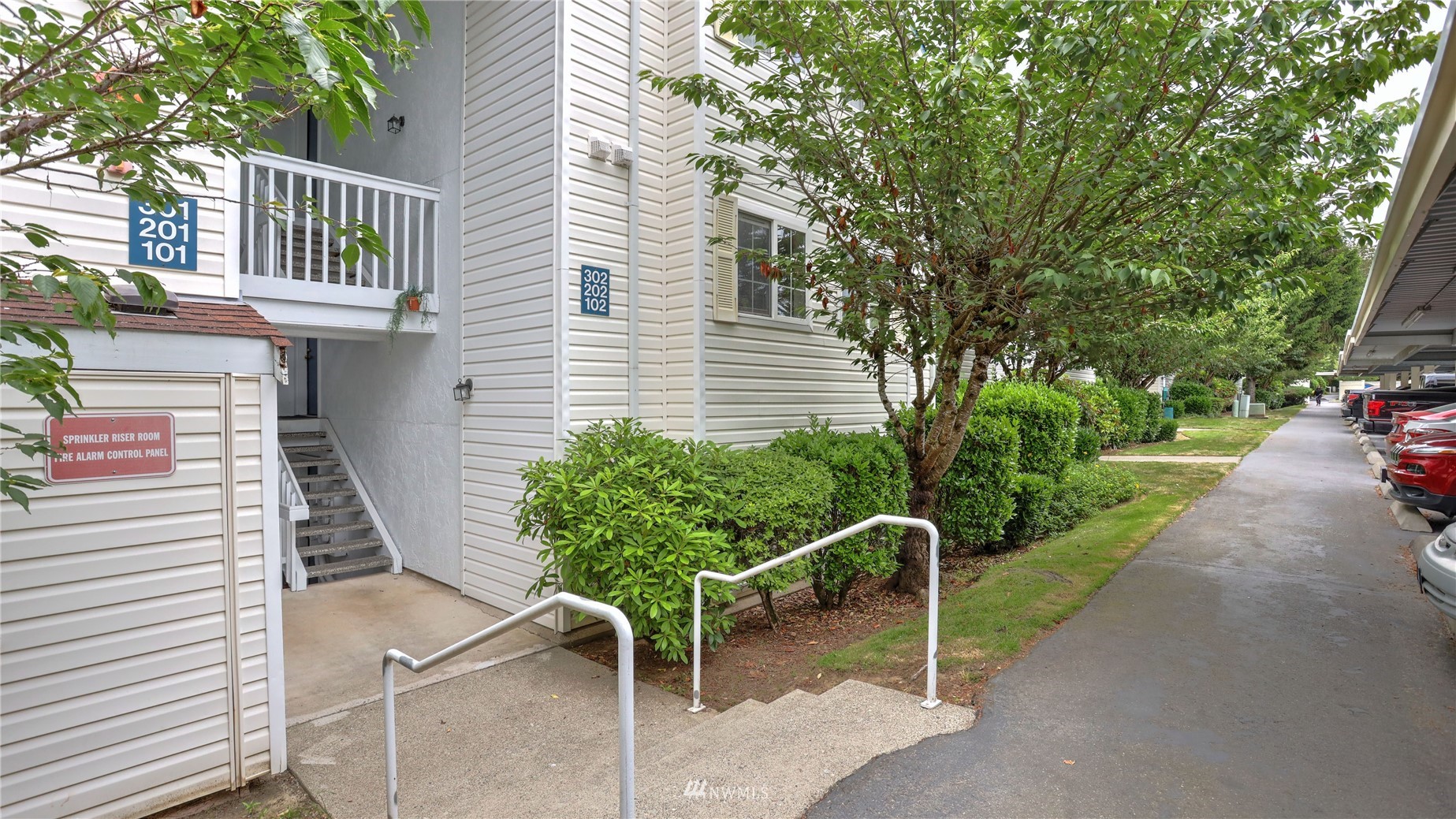 11002 Southeast Petrovitsky Road, Unit H101 Renton, WA 98055 - Photo 2 of 30 a backyard of a house with lots of green space