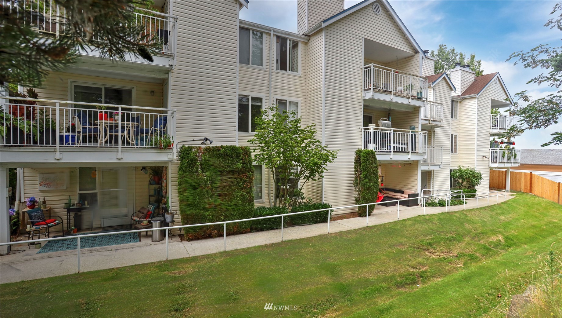 11002 Southeast Petrovitsky Road, Unit H101 Renton, WA 98055 - Photo 25 of 30 a view of a house with backyard and sitting area